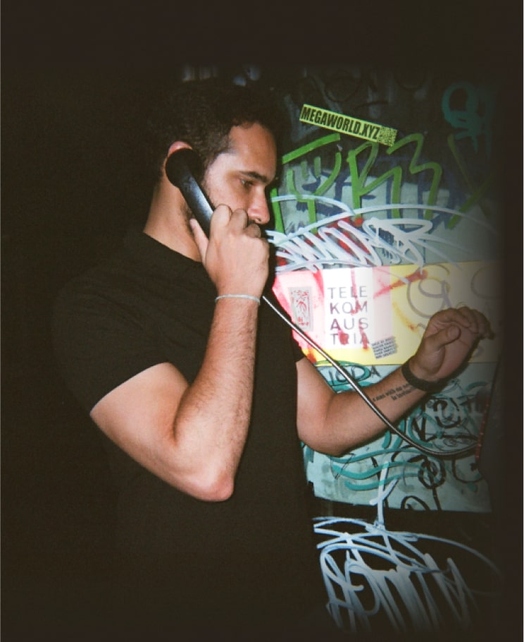 Masry at a payphone in Vienna in 2023